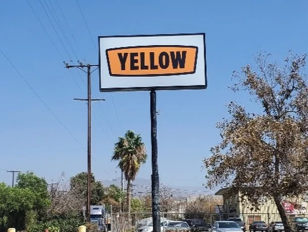 Business Storefront Pole Signage for Yellow LTL Shipping & Logistics Solutions in Gardena, CA.